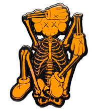 Load image into Gallery viewer, KAWS x NGV &#39;Skeleton&#39; (orange) Enamel Pin